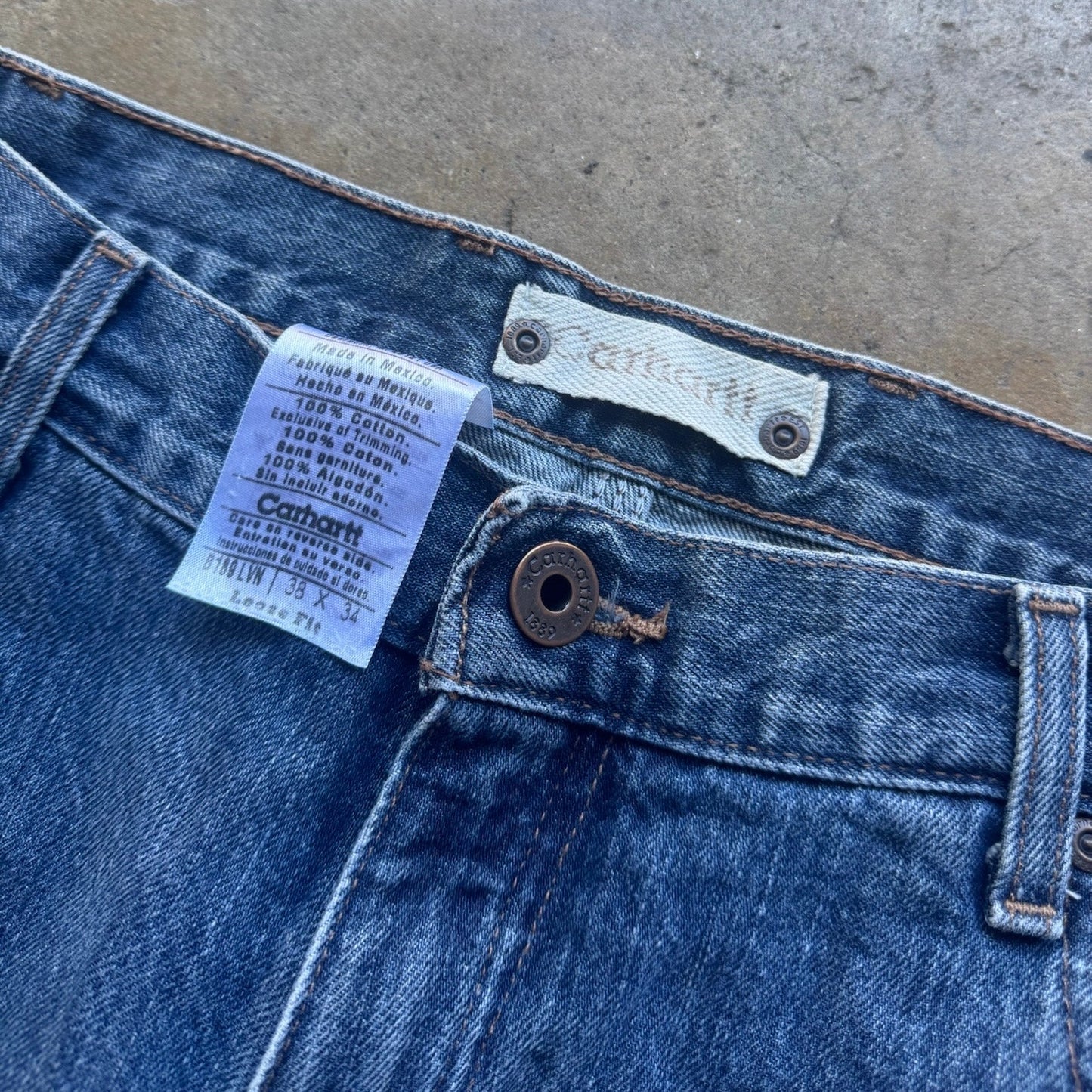 Carhartt Blue denim work pants size 38x34