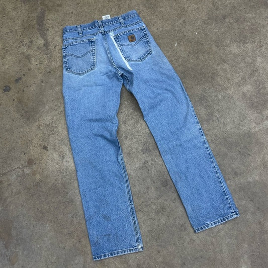 Men’s vintage faded blue Carhartt denim pants size 32x34 (repaired)