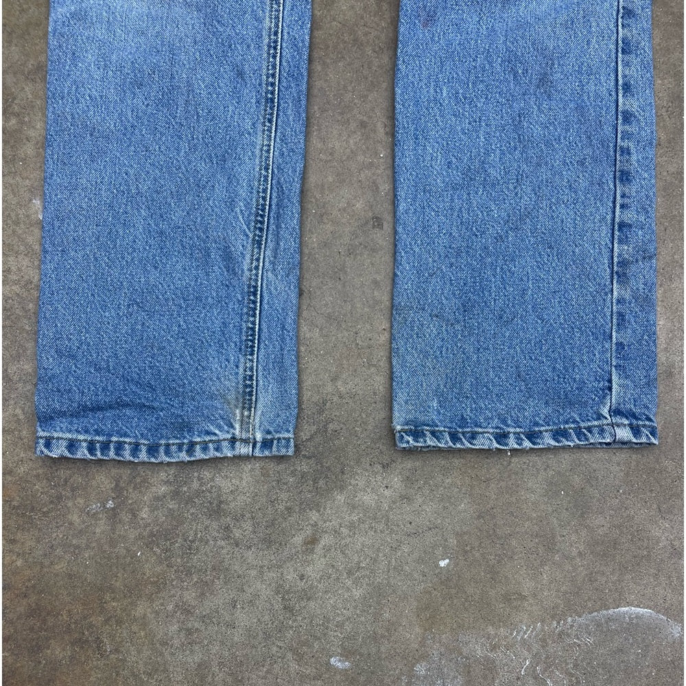 Men’s vintage faded blue Carhartt denim pants size 32x34 (repaired)